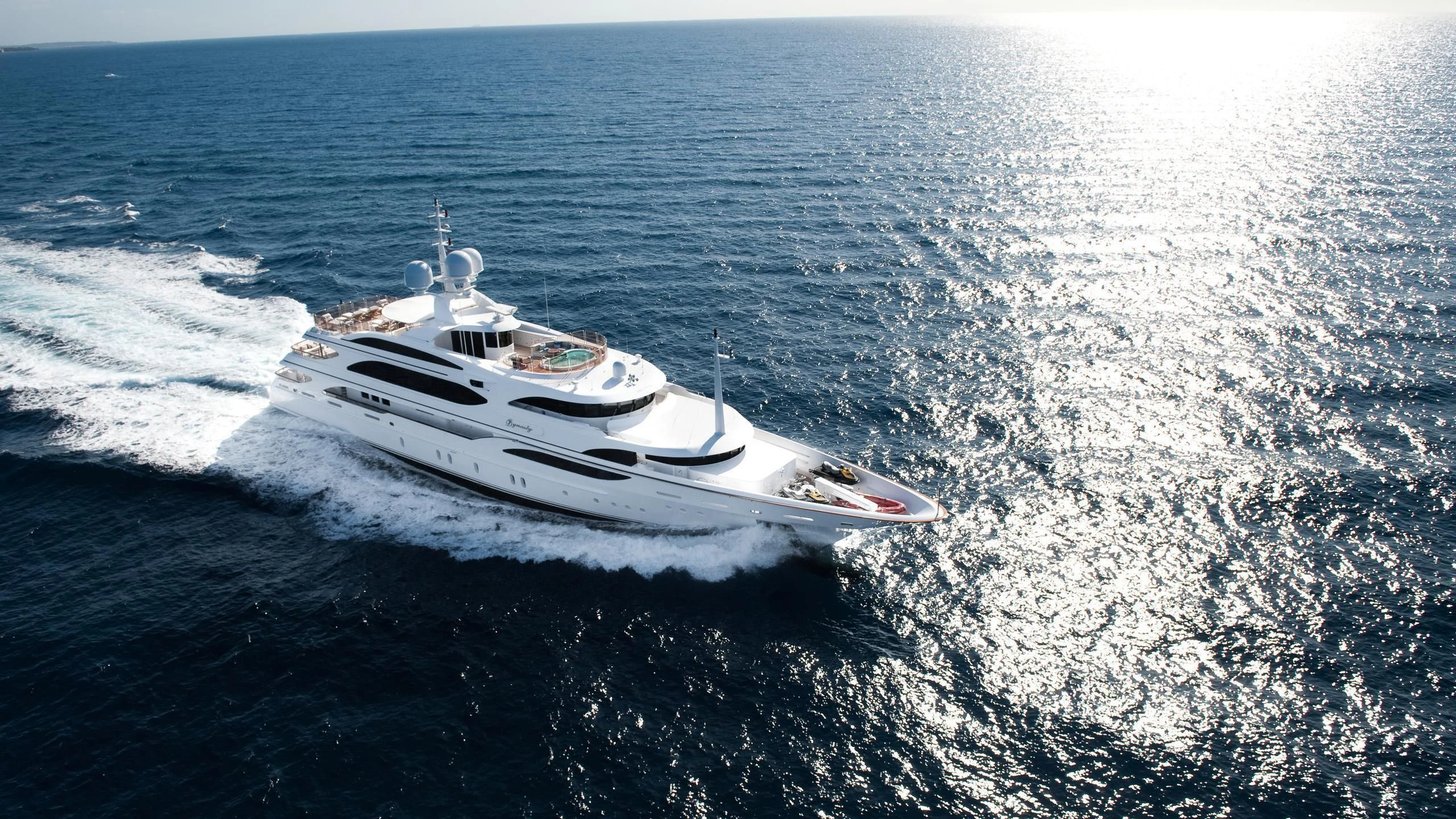 a white yacht in the ocean aboard DILARA Yacht for Sale