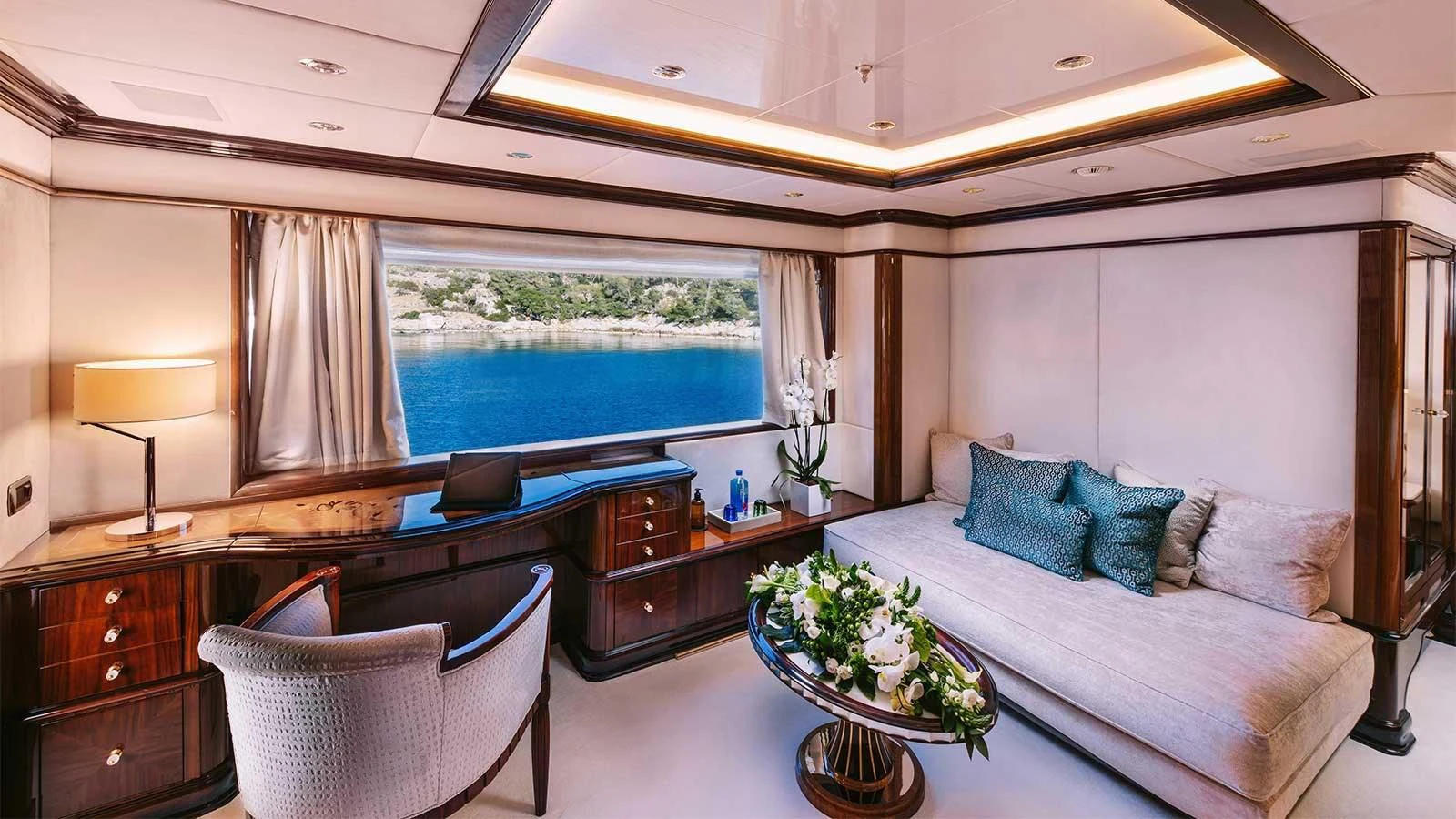 a living room with a large bed aboard DILARA Yacht for Sale