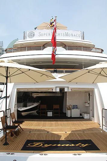 a large white boat with a red star on it aboard DILARA Yacht for Sale