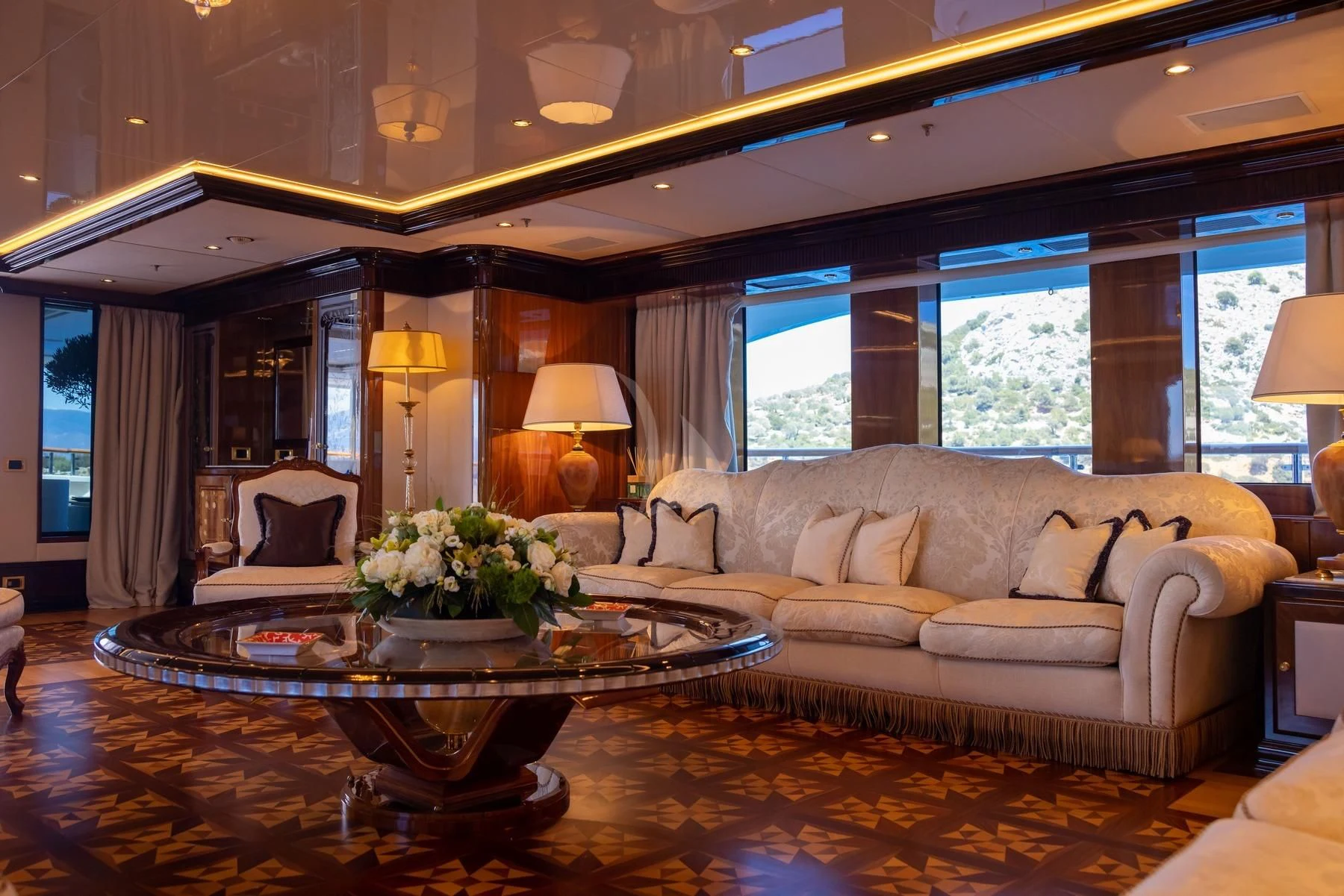 a living room with a large window aboard DILARA Yacht for Sale