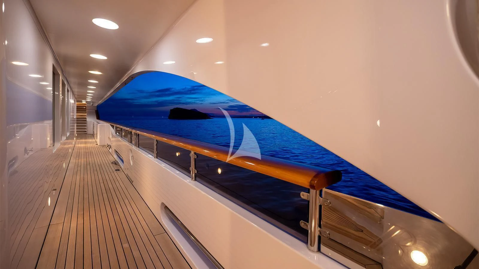 a large blue and yellow boat on a wooden dock aboard DILARA Yacht for Sale