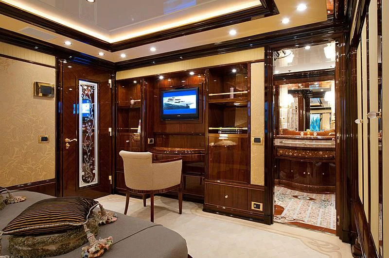 a room with a bed and a tv aboard DILARA Yacht for Sale