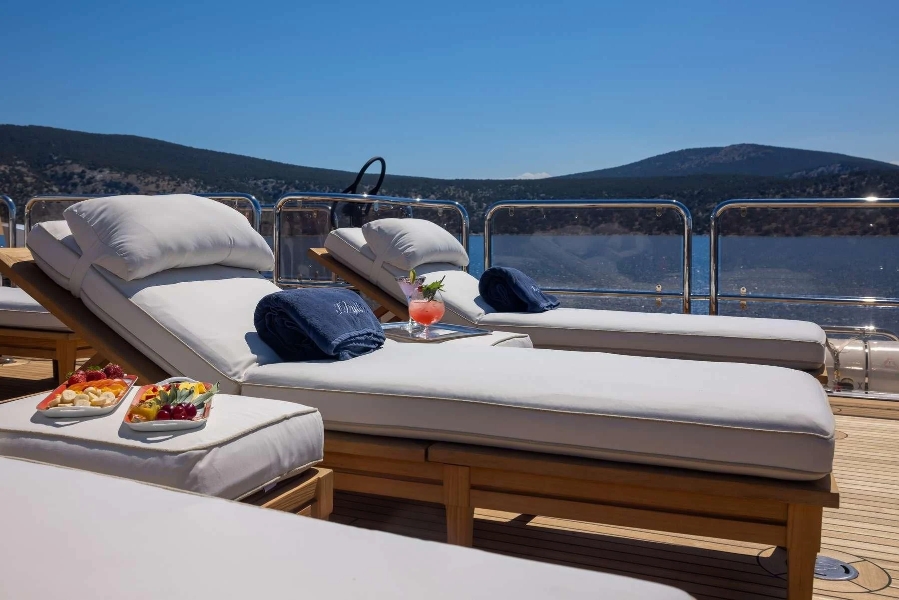 a bed with a tray of food on it aboard DILARA Yacht for Sale