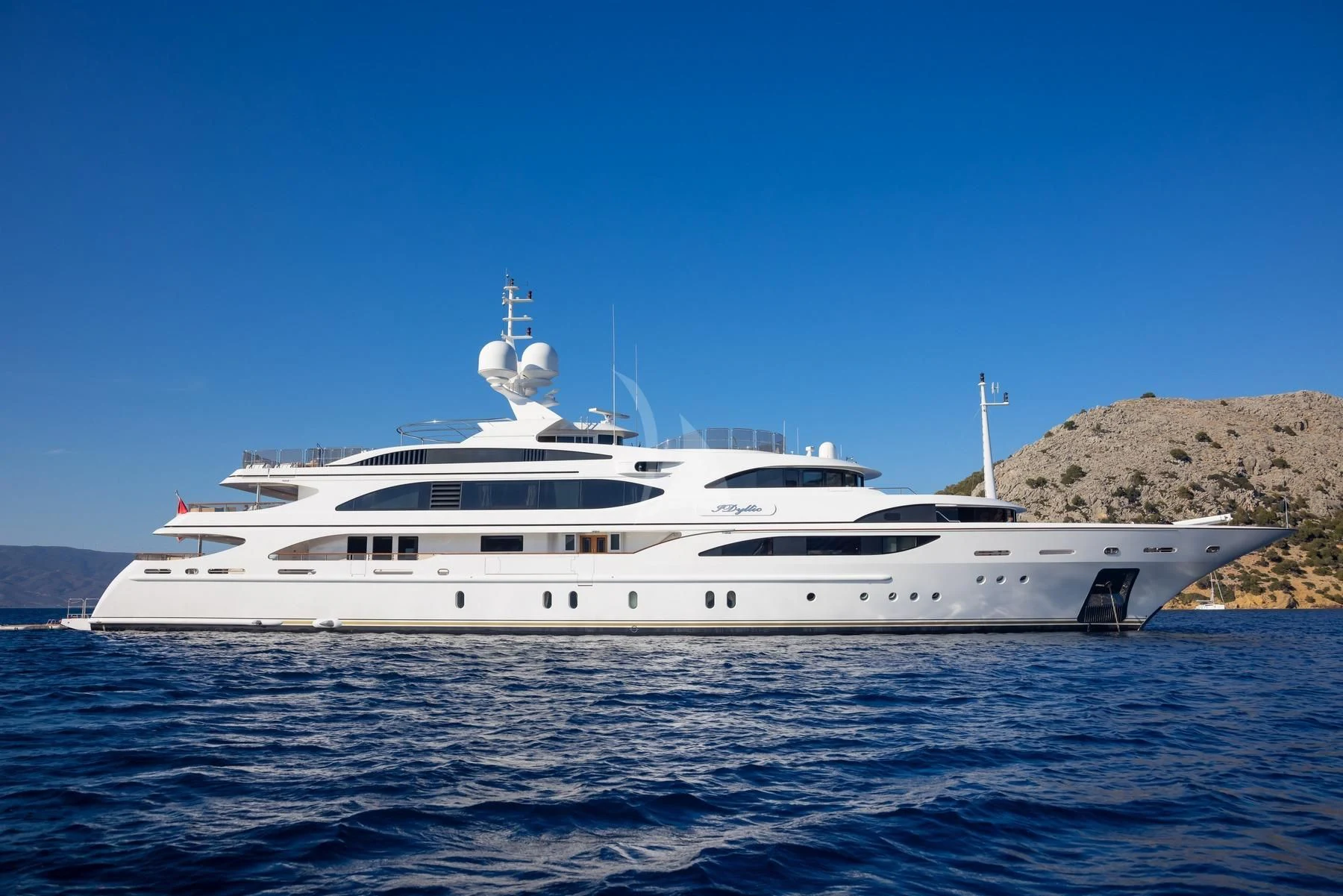 a white yacht in the water aboard DILARA Yacht for Sale