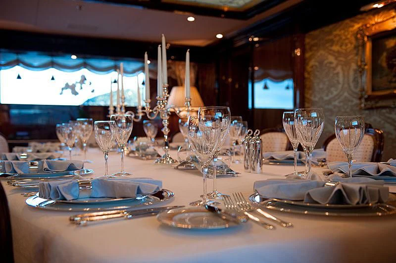 a table set with place settings aboard DILARA Yacht for Sale