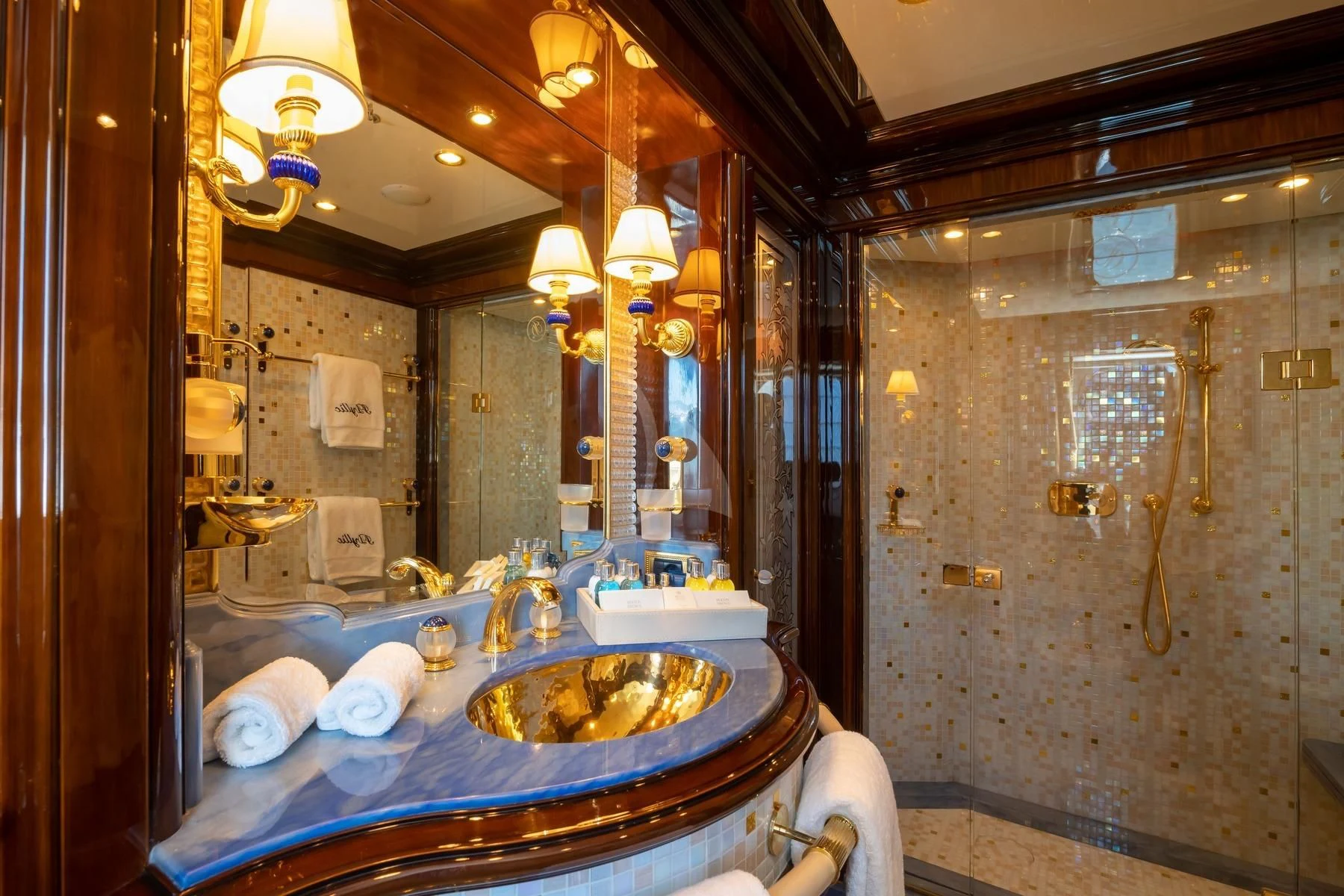 a bathroom with a sink and a large mirror aboard DILARA Yacht for Sale