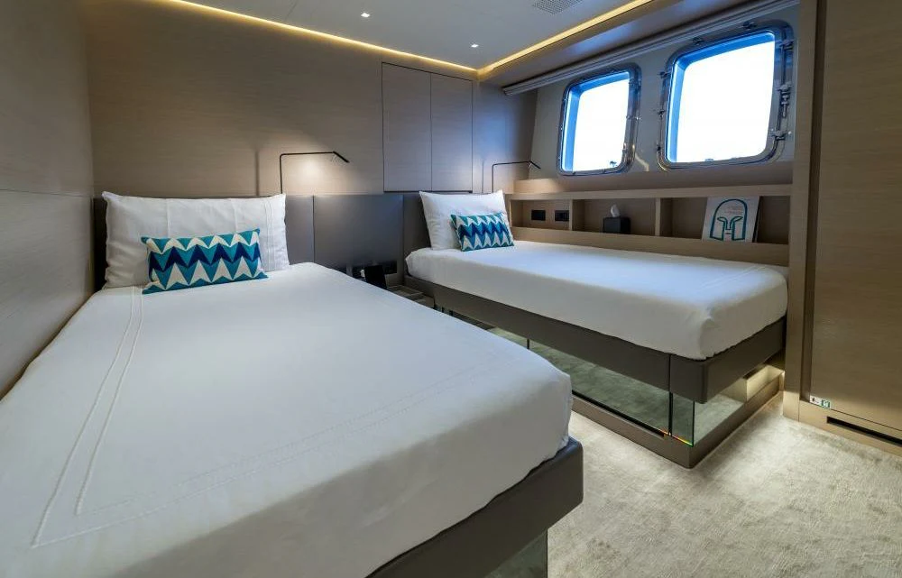 a room with two beds aboard DILARA Yacht for Sale