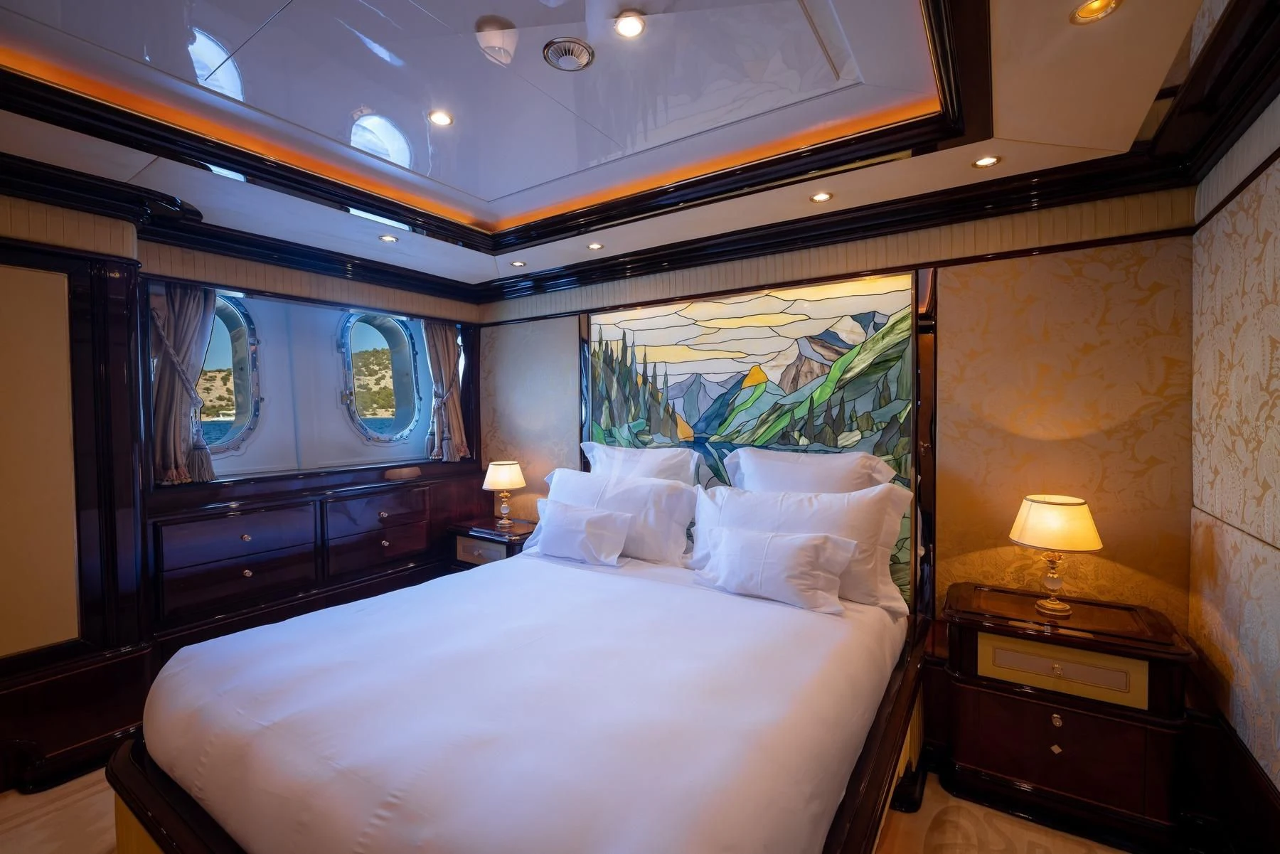 a bedroom with a large bed aboard DILARA Yacht for Sale