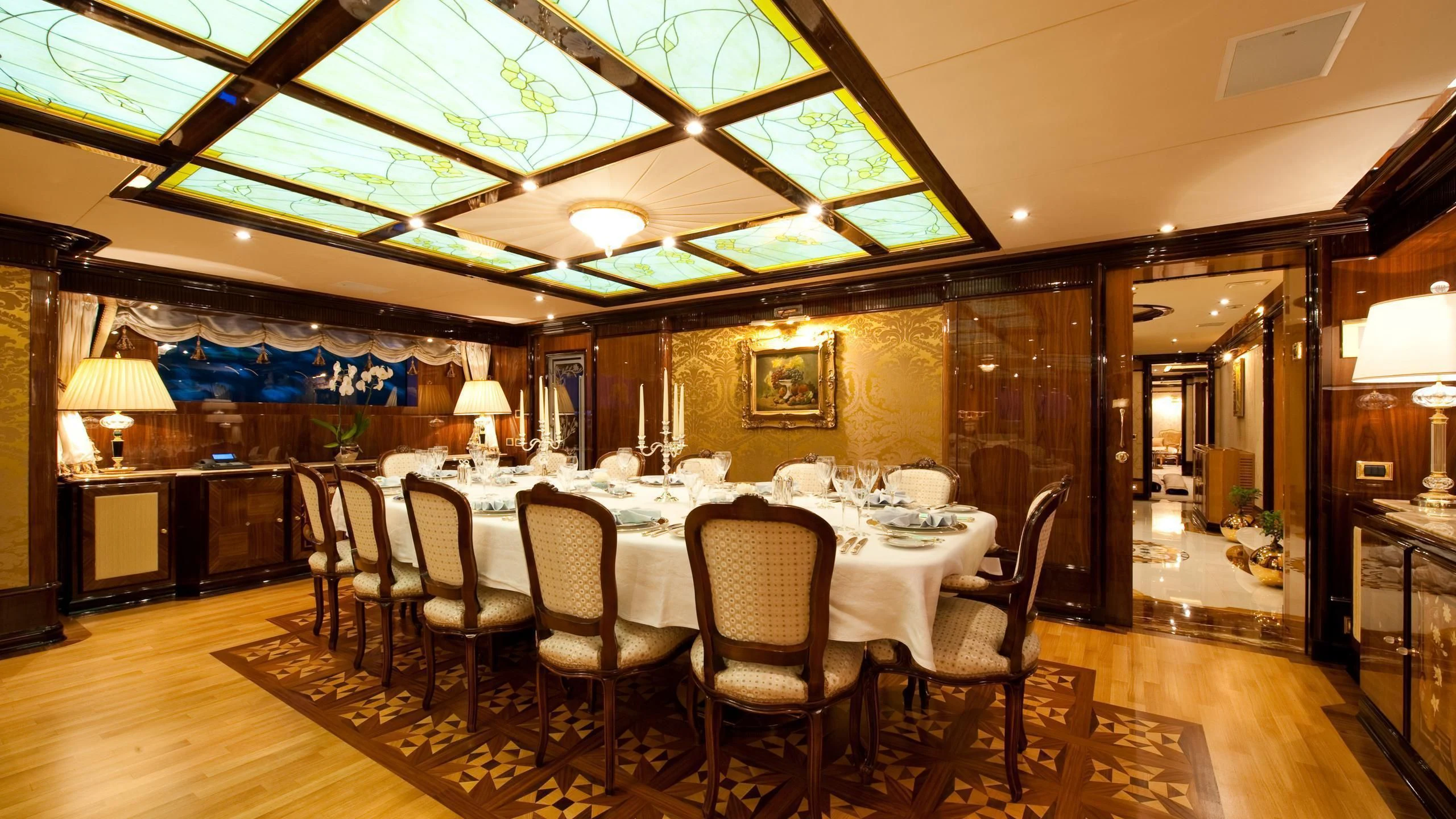 a dining room with a table and chairs aboard DILARA Yacht for Sale