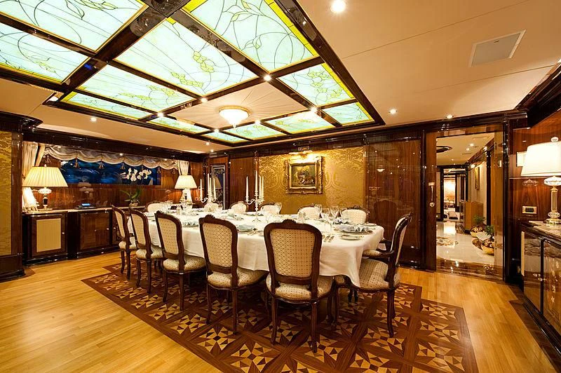 a dining room with a table and chairs aboard DILARA Yacht for Sale