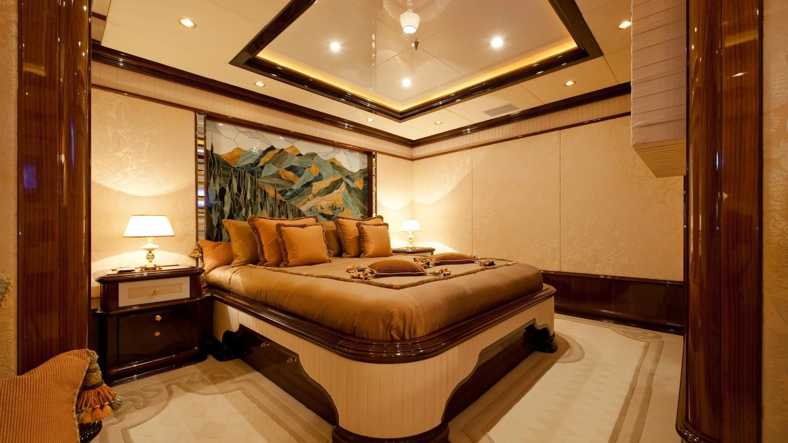 a hotel room with a bed and a large mirror aboard DILARA Yacht for Sale