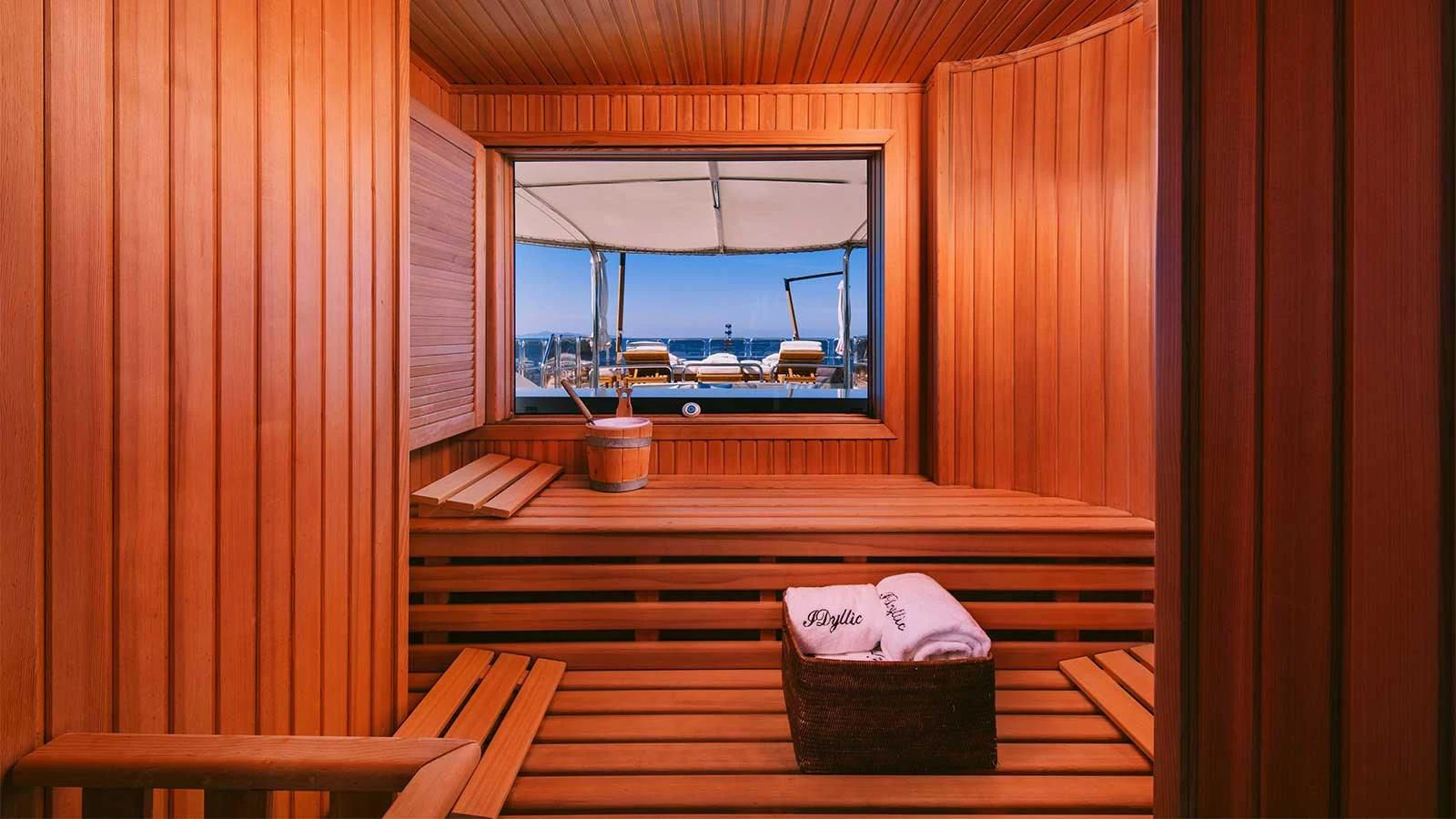 a room with a bench and a window aboard DILARA Yacht for Sale