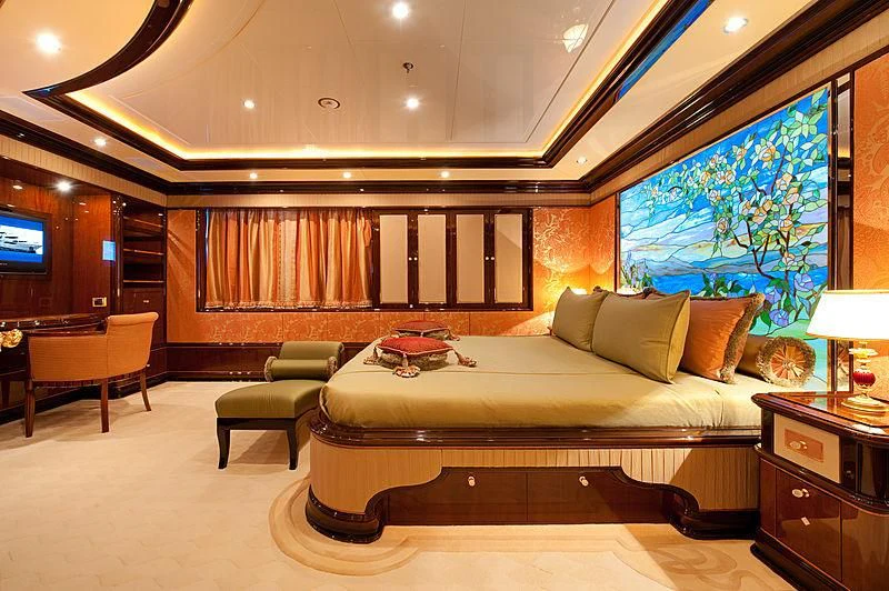 a large living room with a large bed and a large window aboard DILARA Yacht for Sale