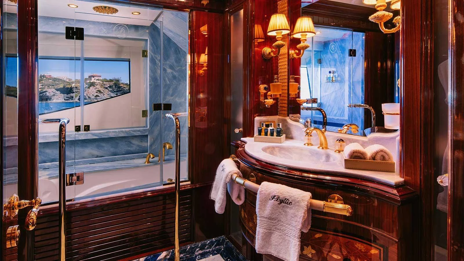 a bathroom with a large mirror aboard DILARA Yacht for Sale
