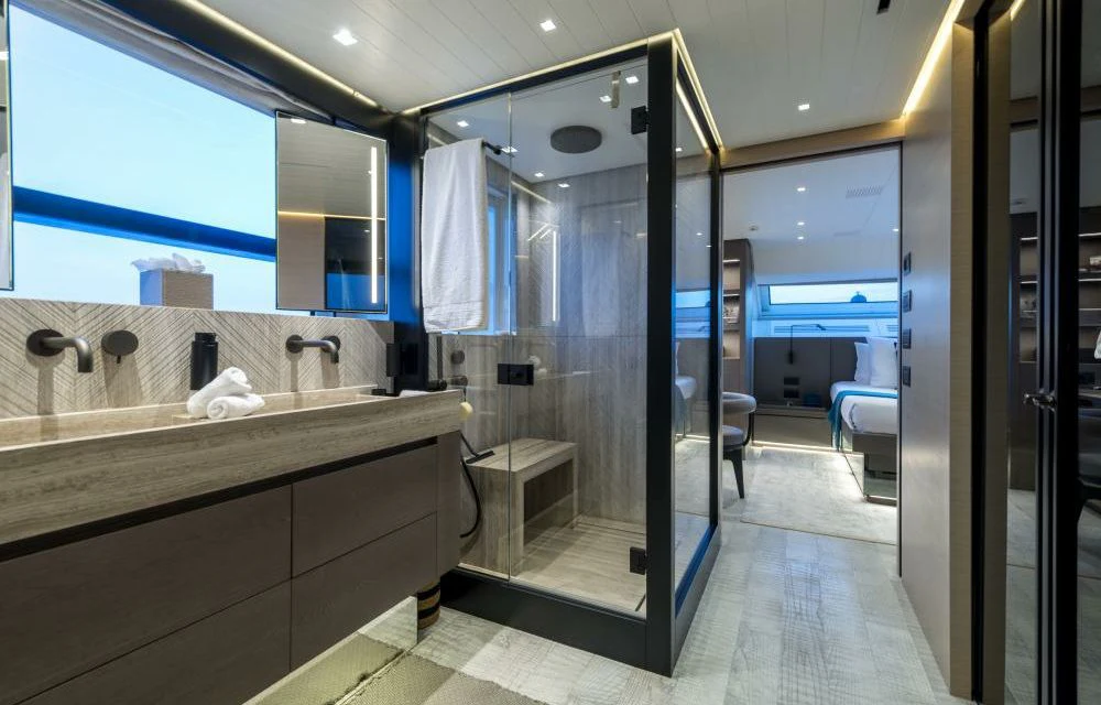 a bathroom with a glass shower aboard DILARA Yacht for Sale