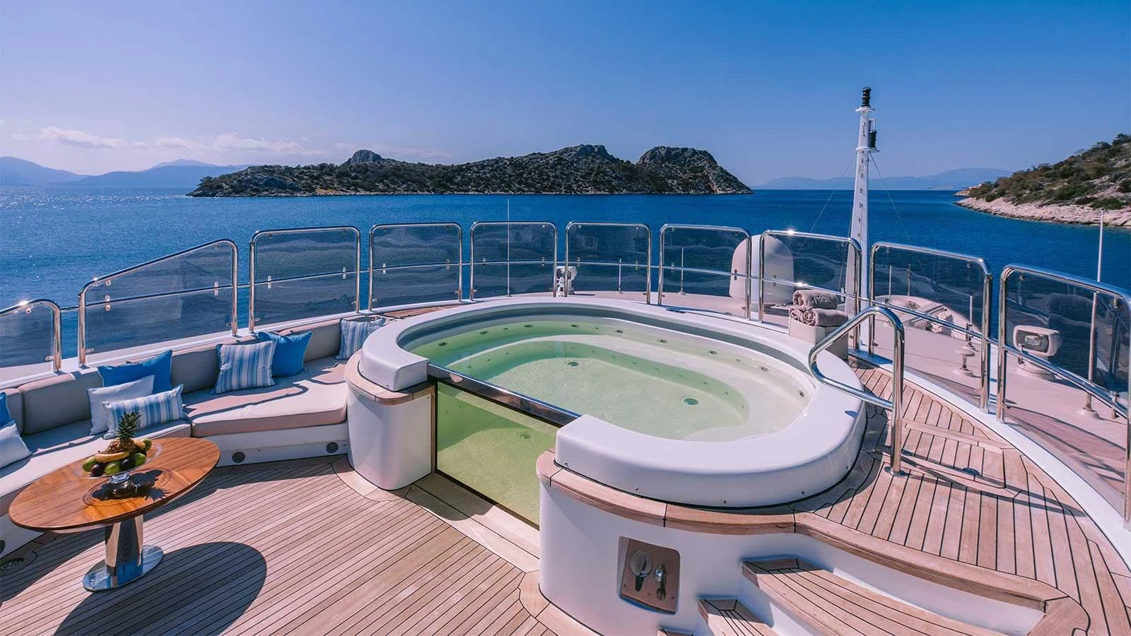a large swimming pool on a deck aboard DILARA Yacht for Sale