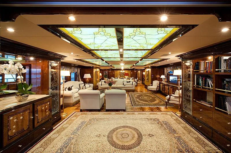 a room with a couch and a table aboard DILARA Yacht for Sale