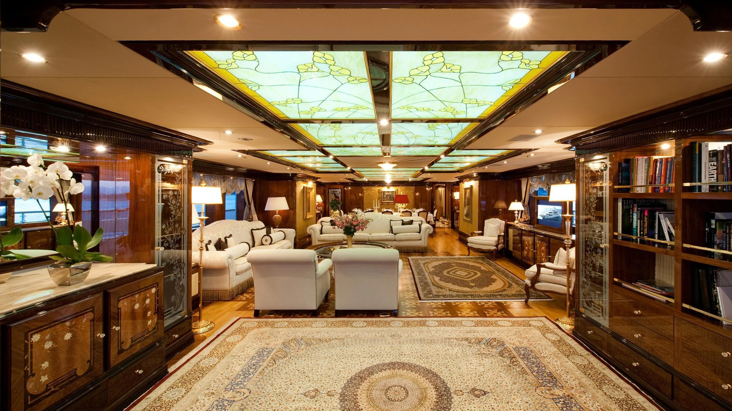 a living room with a large mirror aboard DILARA Yacht for Sale