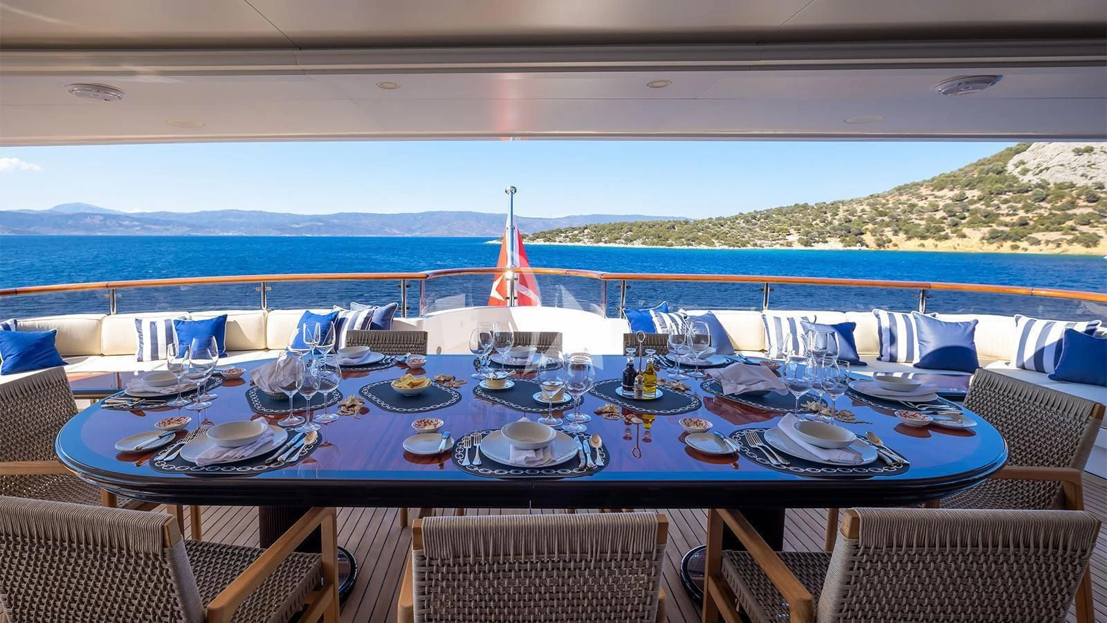 a table set for a dinner aboard DILARA Yacht for Sale