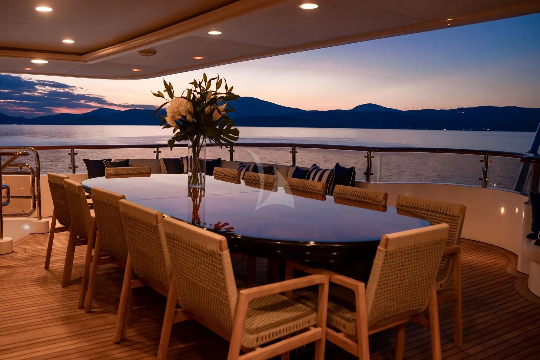 a large pool with chairs and tables aboard DILARA Yacht for Sale