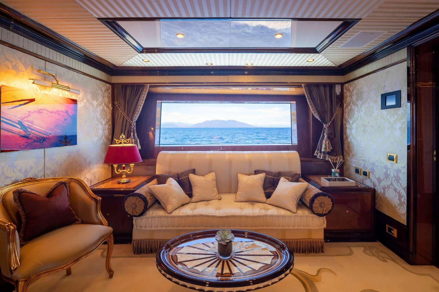 a living room with a large window aboard DILARA Yacht for Sale