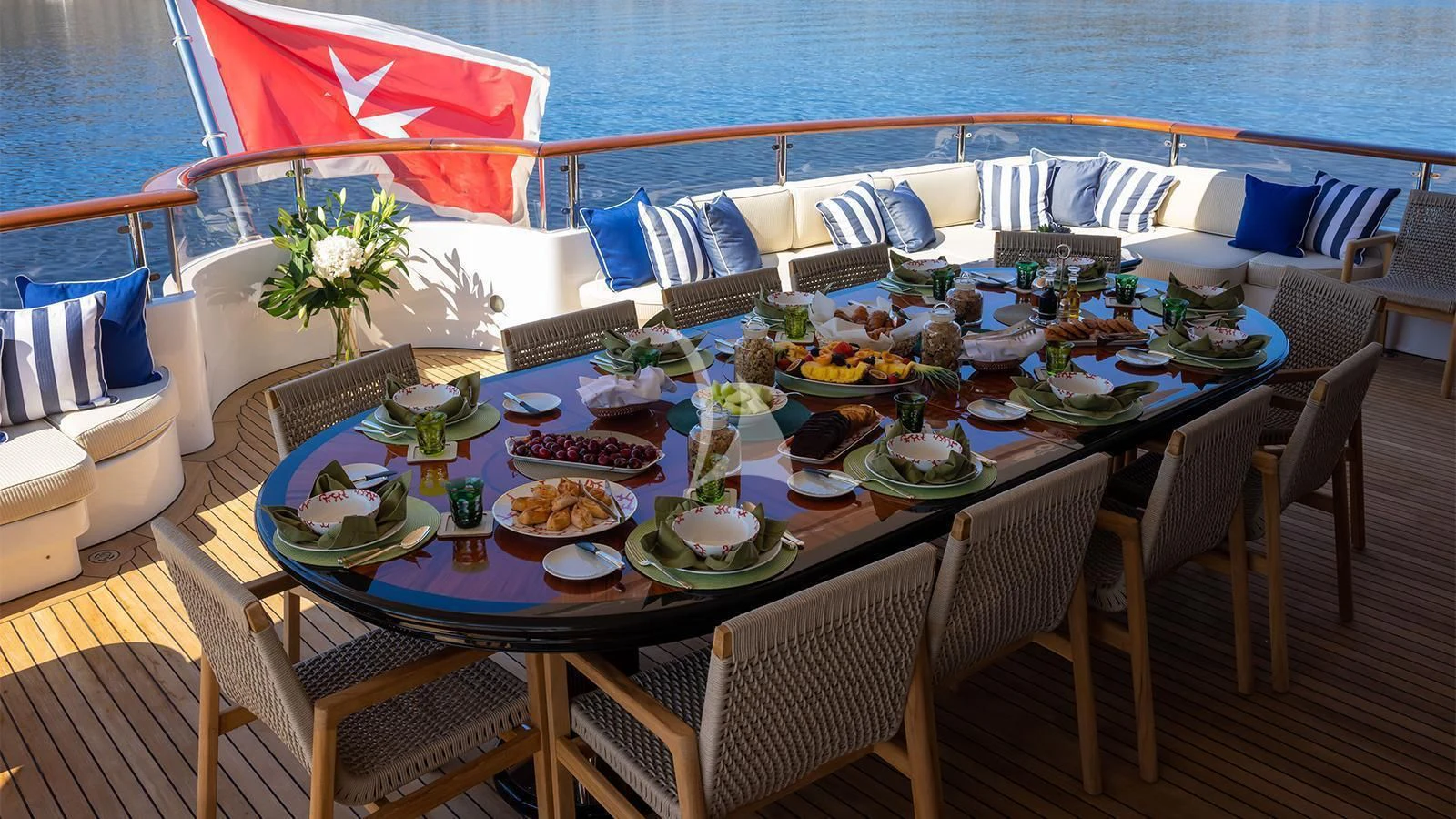 a table set for a dinner on a boat aboard DILARA Yacht for Sale