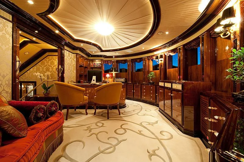 a large room with a table and chairs aboard DILARA Yacht for Sale