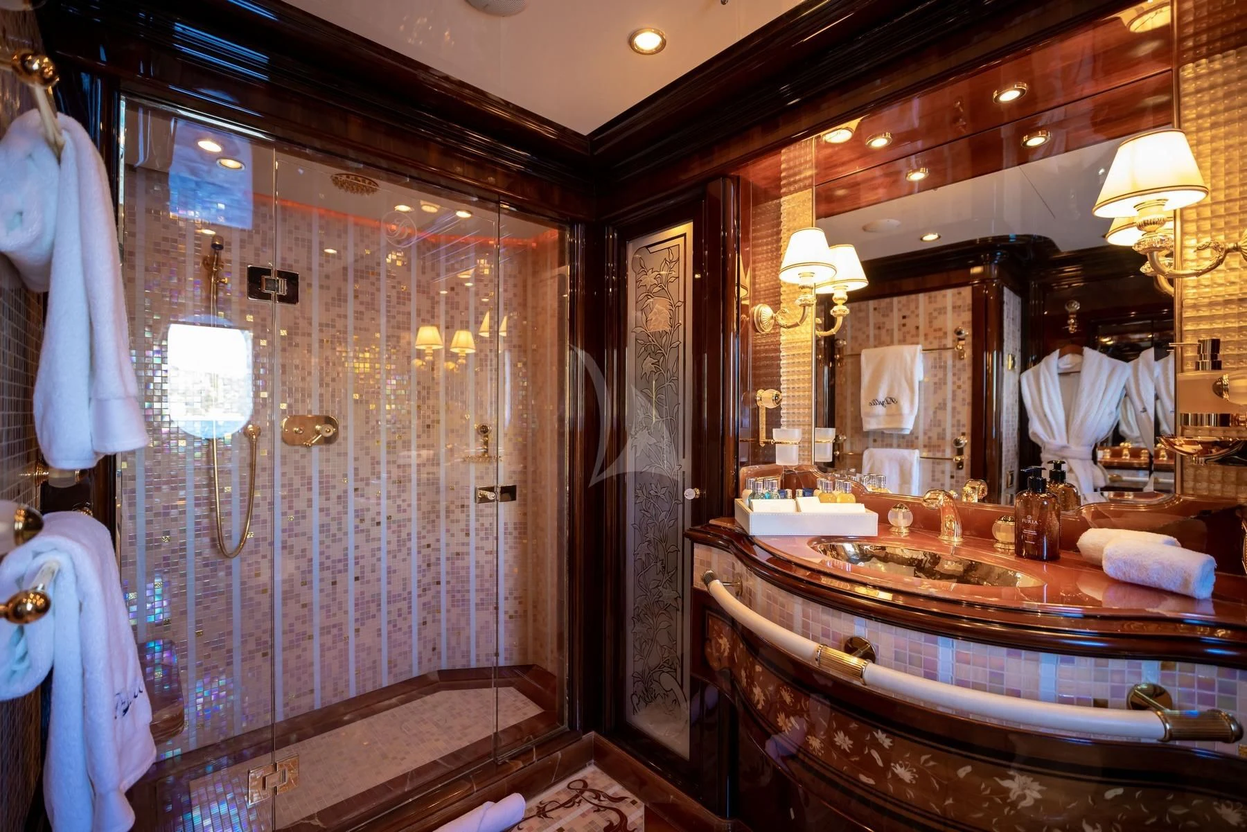 a bathroom with a large mirror aboard DILARA Yacht for Sale
