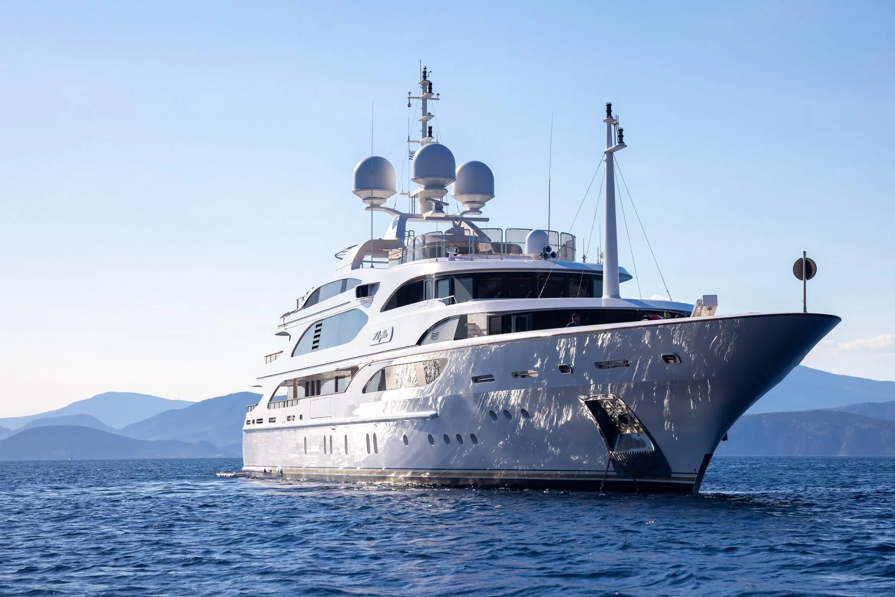a large white boat in the water aboard DILARA Yacht for Sale