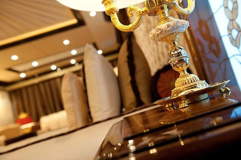a gold statue on a stand aboard DILARA Yacht for Sale