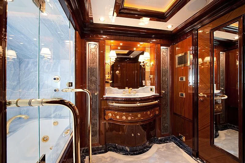 a bathroom with a large mirror aboard DILARA Yacht for Sale