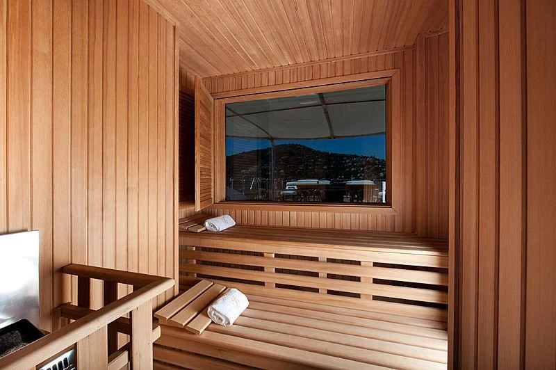 a room with a window and wood walls aboard DILARA Yacht for Sale