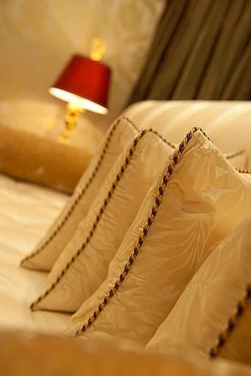 a gold and white pillow aboard DILARA Yacht for Sale