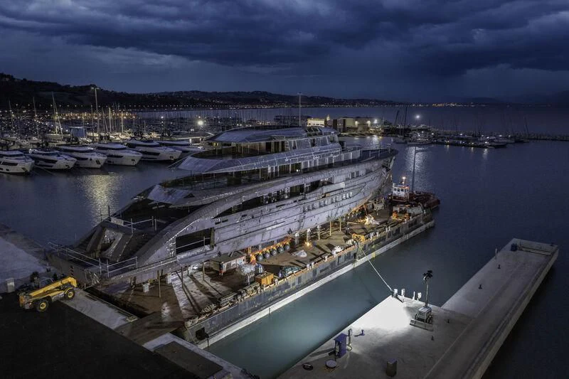 a large ship in a harbor aboard AMOR À VIDA Yacht for Sale