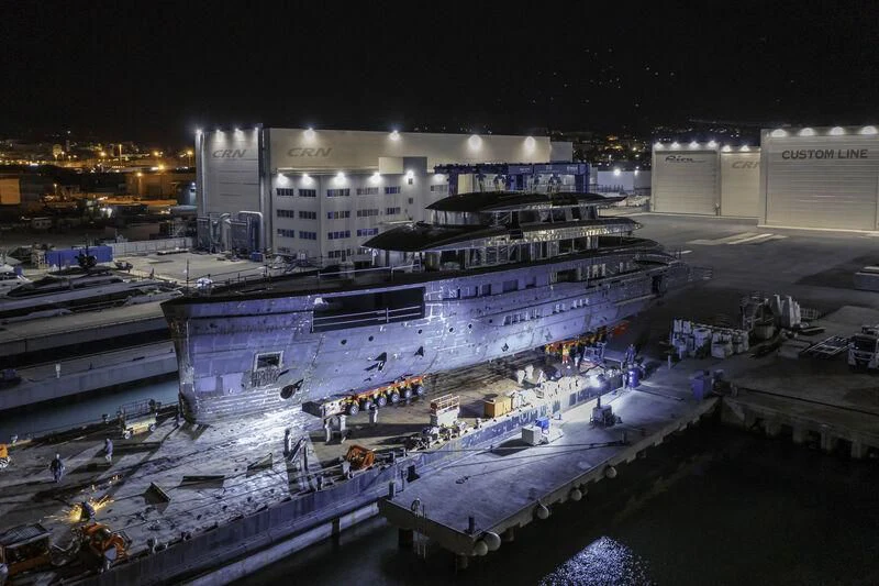 a large building with a large pool in front of it aboard AMOR À VIDA Yacht for Sale