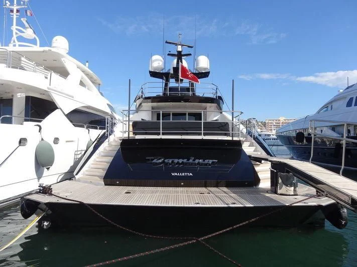 a boat docked at a pier aboard DOMINO Yacht for Sale