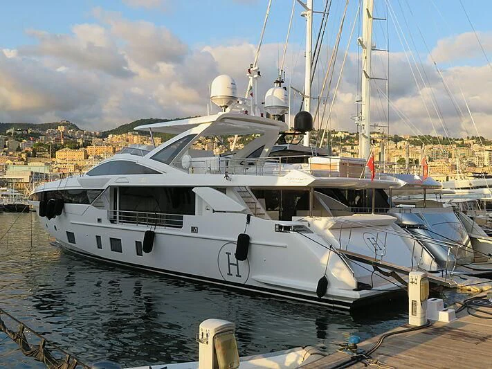 a boat docked at a pier aboard NEMESIS Yacht for Sale