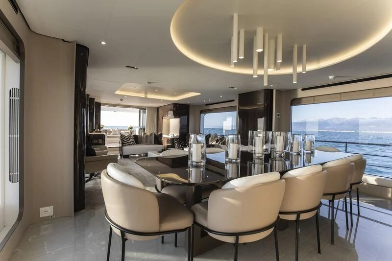 a large room with a large table and chairs aboard NEMESIS Yacht for Sale