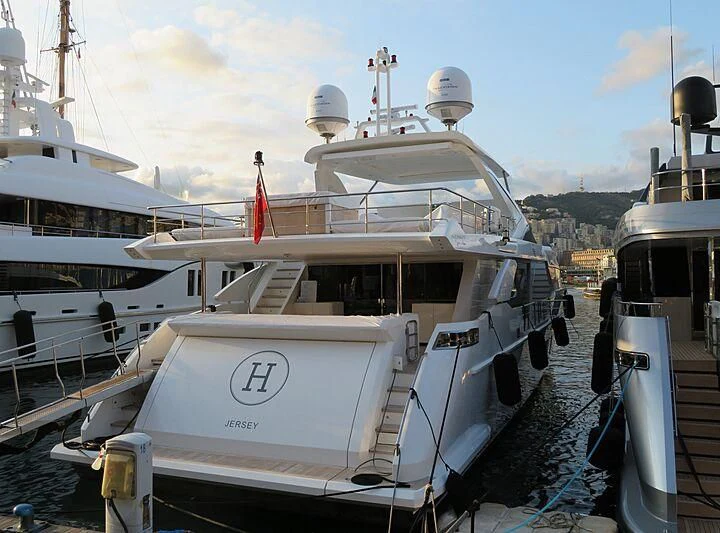 a boat docked at a pier aboard NEMESIS Yacht for Sale