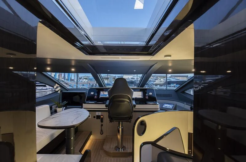 a room with a table and chairs aboard NEMESIS Yacht for Sale