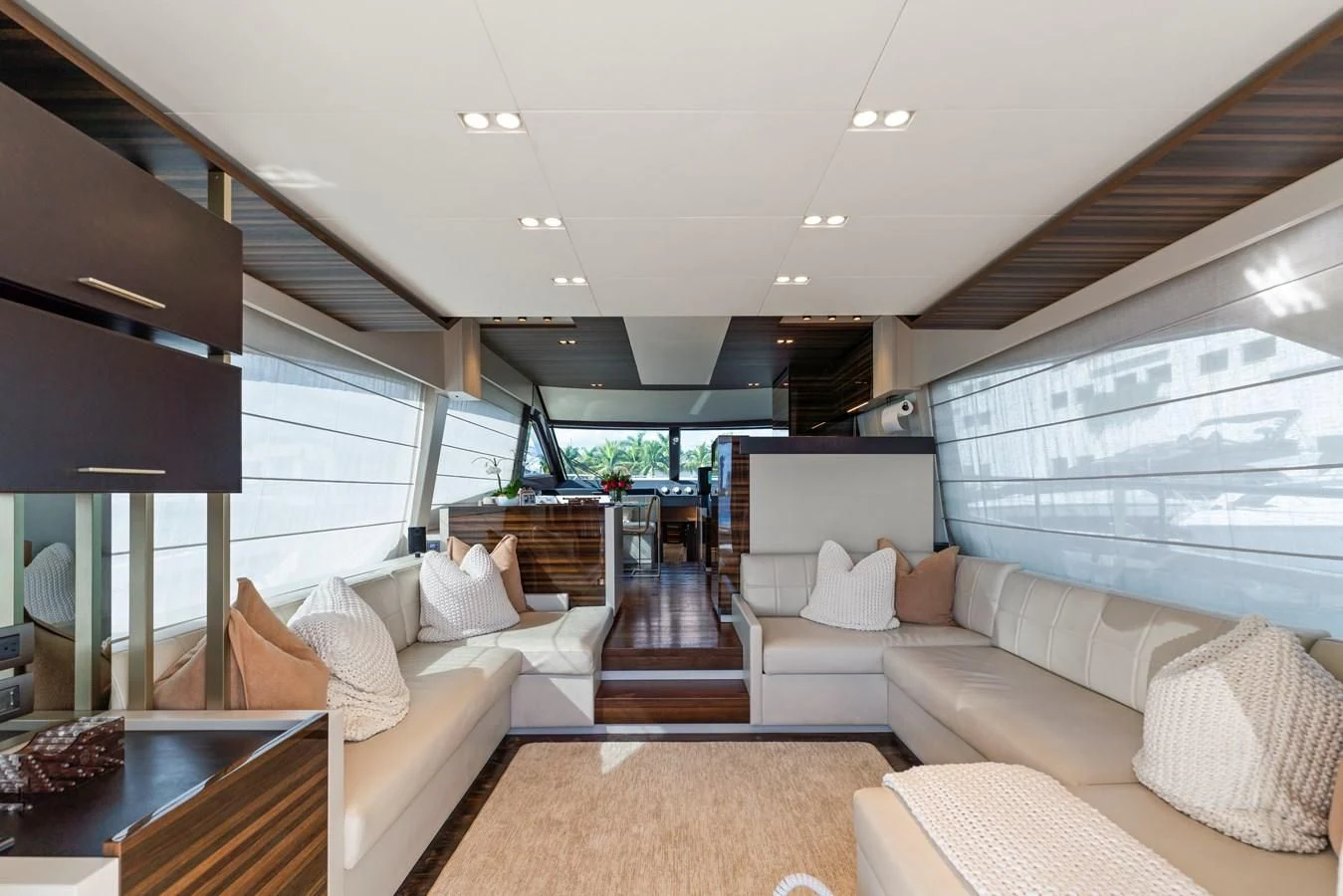a living room with a large window aboard LEGEND Yacht for Sale