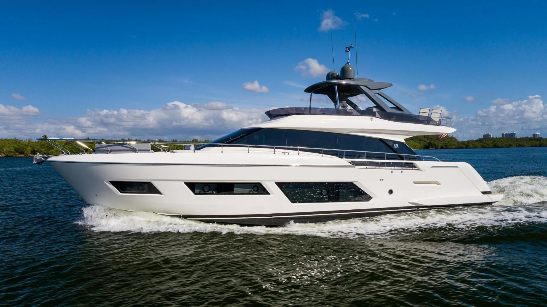 a white yacht on the water aboard LEGEND Yacht for Sale