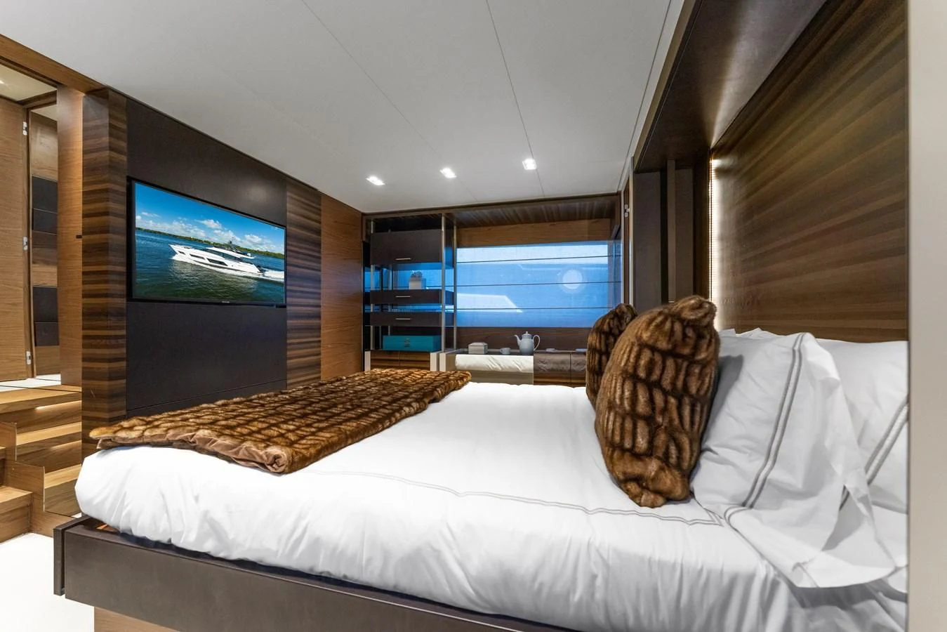 a bed with a pillow on it aboard LEGEND Yacht for Sale