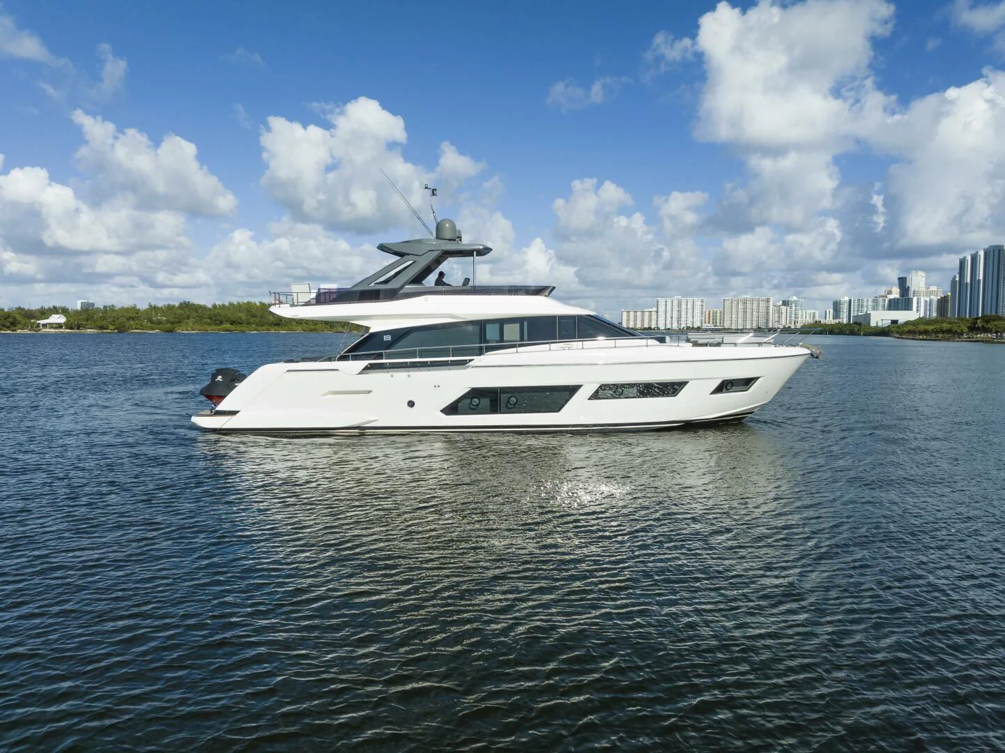 a white yacht on the water aboard LEGEND Yacht for Sale