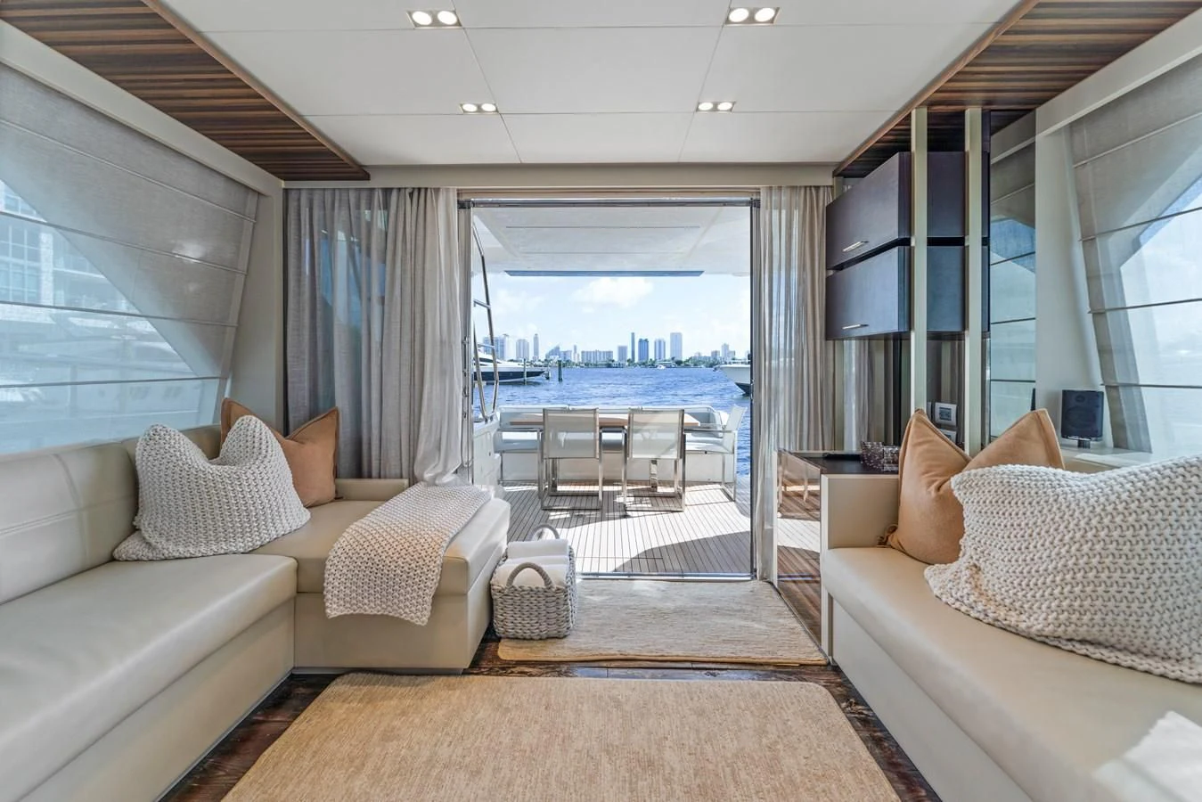 a living room with a large window aboard LEGEND Yacht for Sale