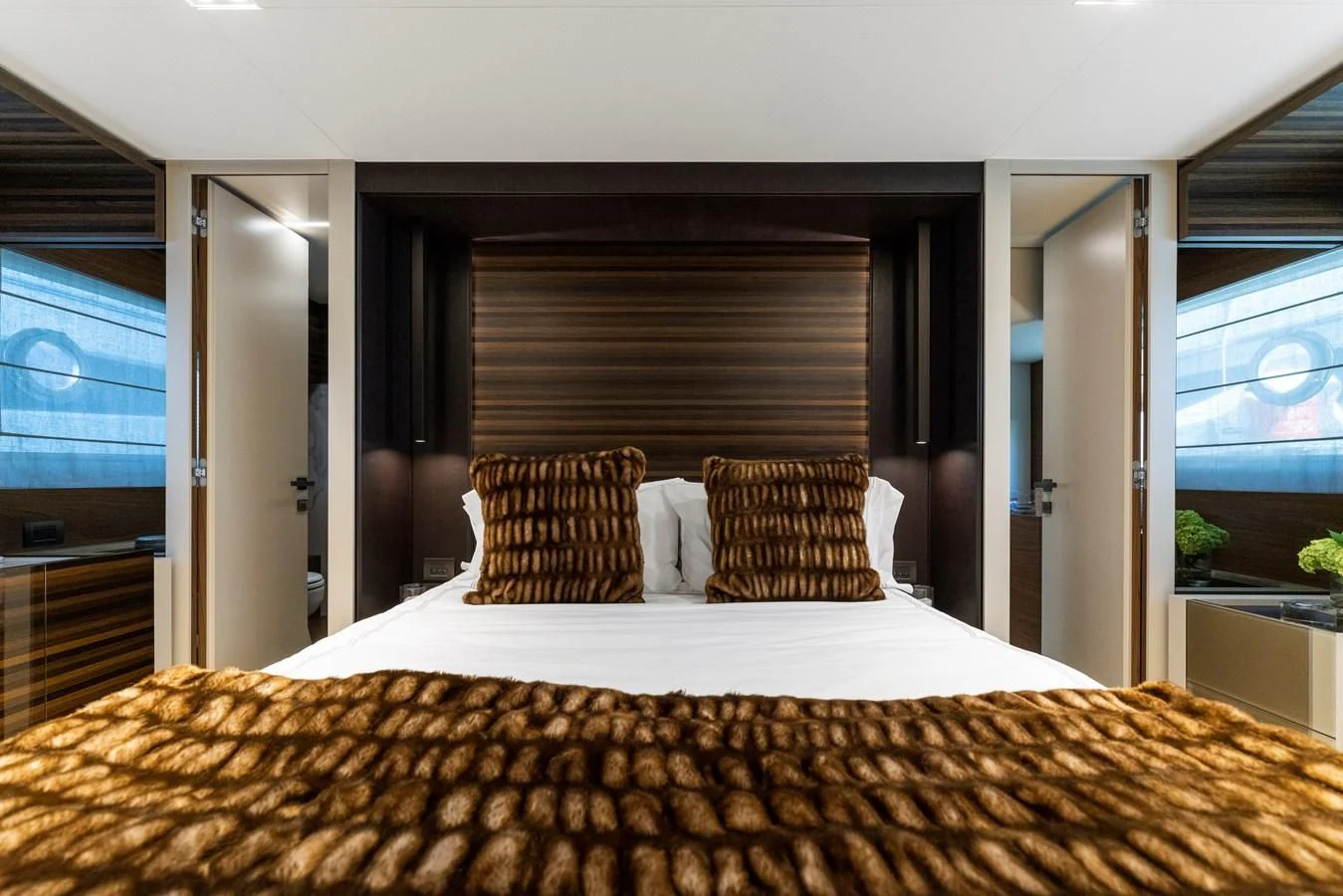 a bed with pillows aboard LEGEND Yacht for Sale