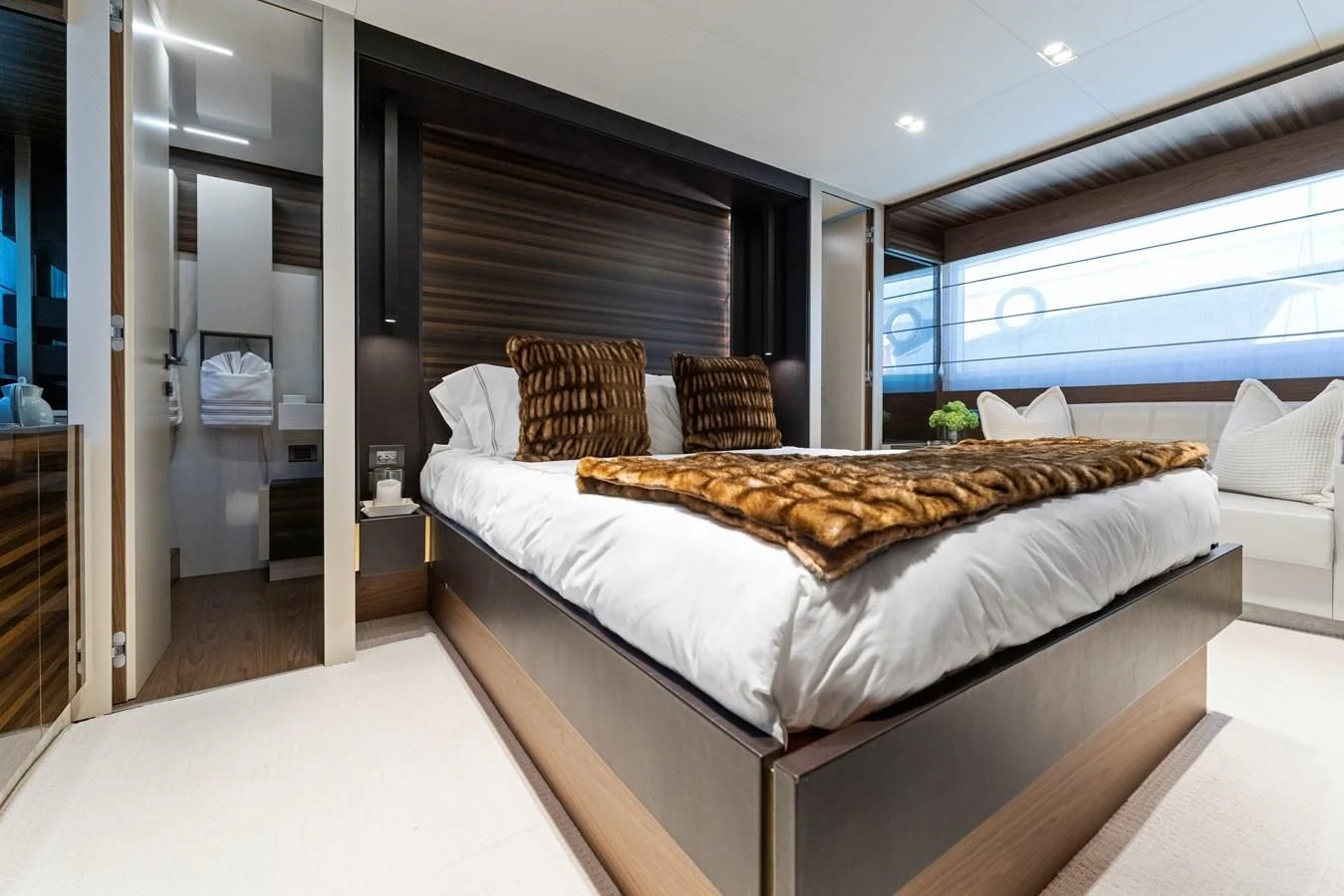 a bed in a room aboard LEGEND Yacht for Sale