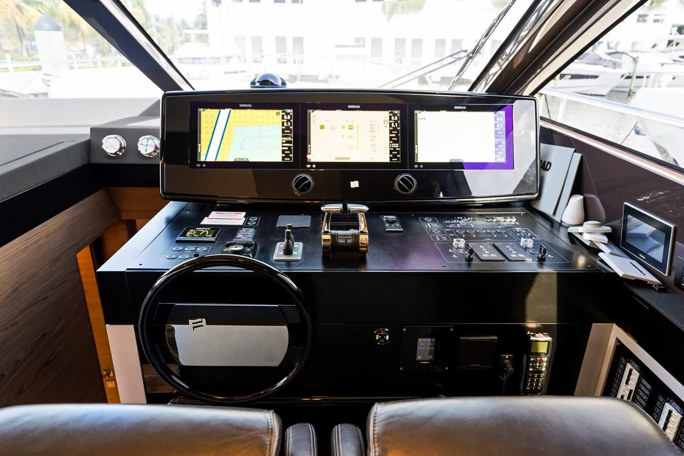 a black console with a screen and buttons on it aboard LEGEND Yacht for Sale