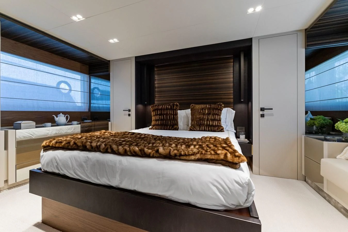 a bedroom with a large bed aboard LEGEND Yacht for Sale