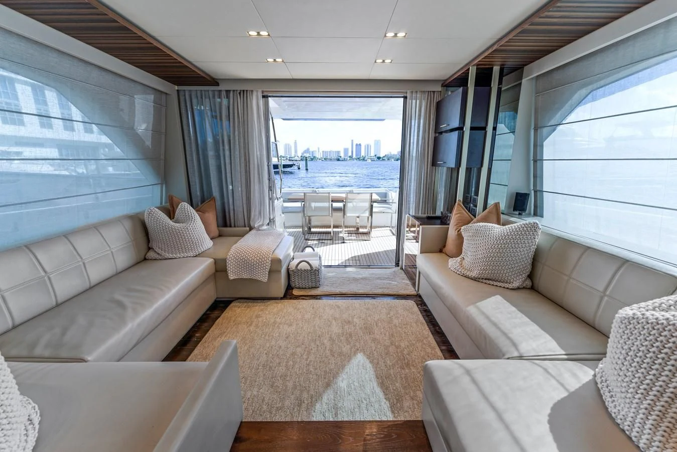 a living room with a large window aboard LEGEND Yacht for Sale